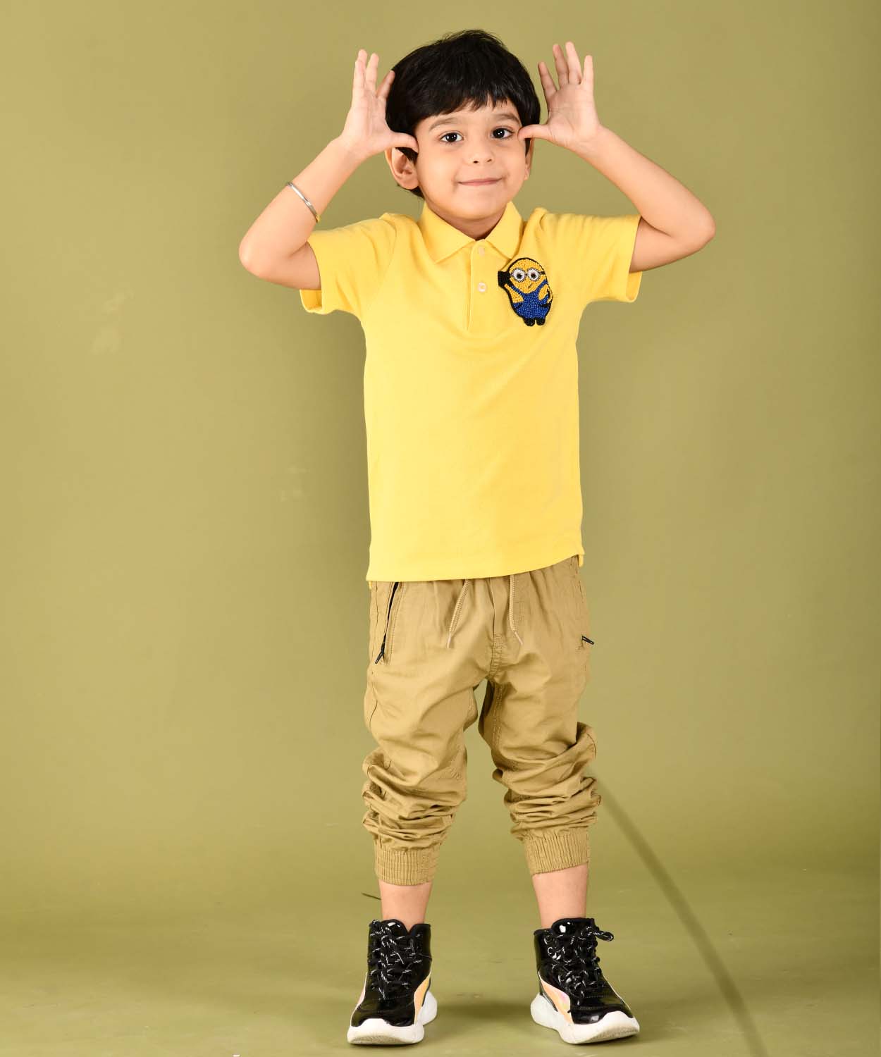 Yellow Boy Polo Tee With Hand Embelished Minion Motif