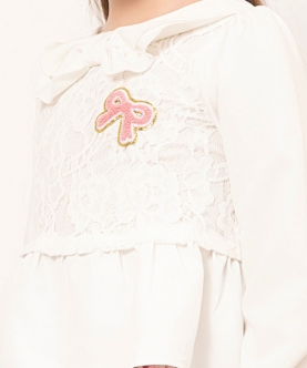Varsity Chic Off-White Top with Playful Pink Bow Detail